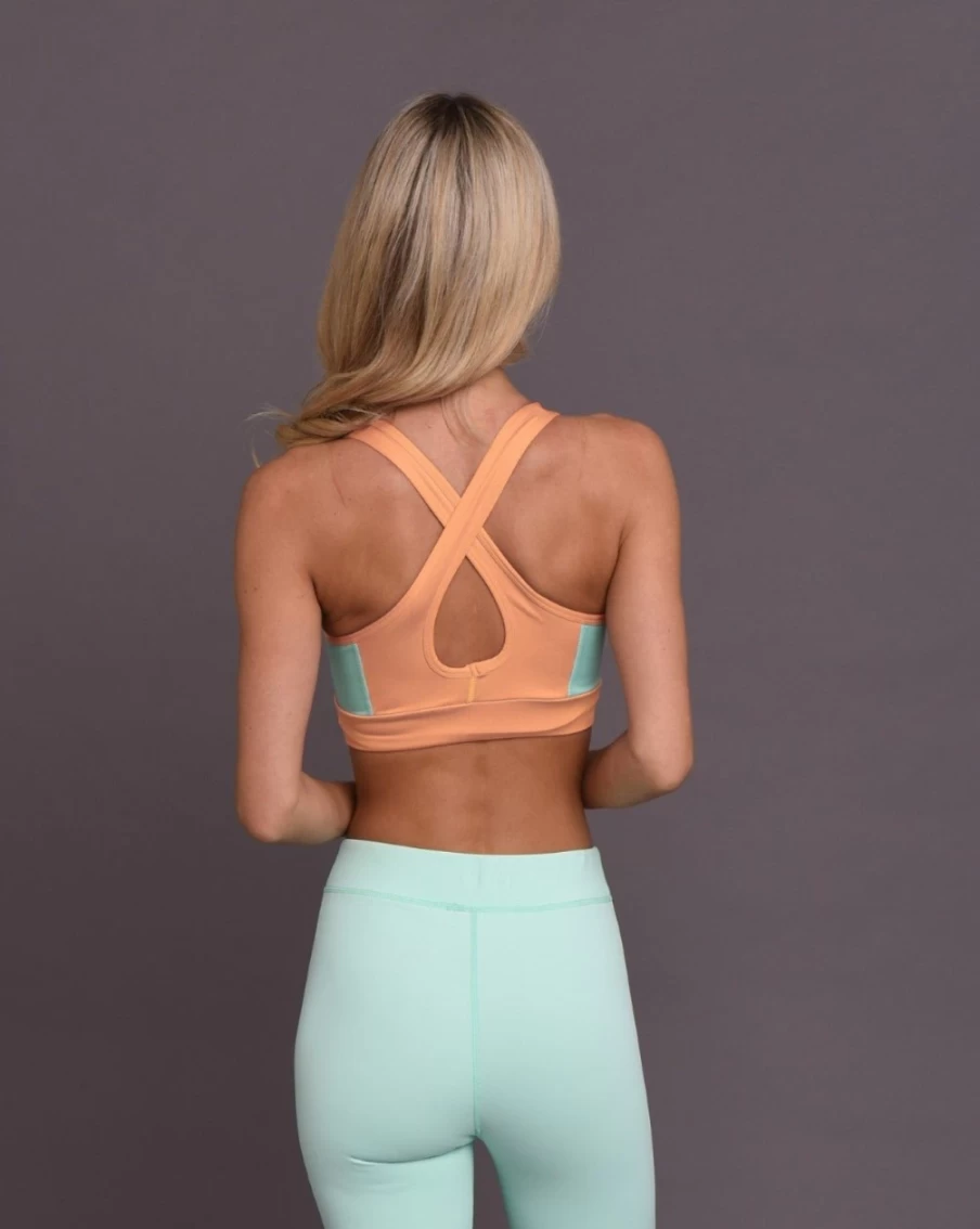 OOSC Women's Pastel Peach Orange Crossback Sports Bra - Medium Support Workout Top